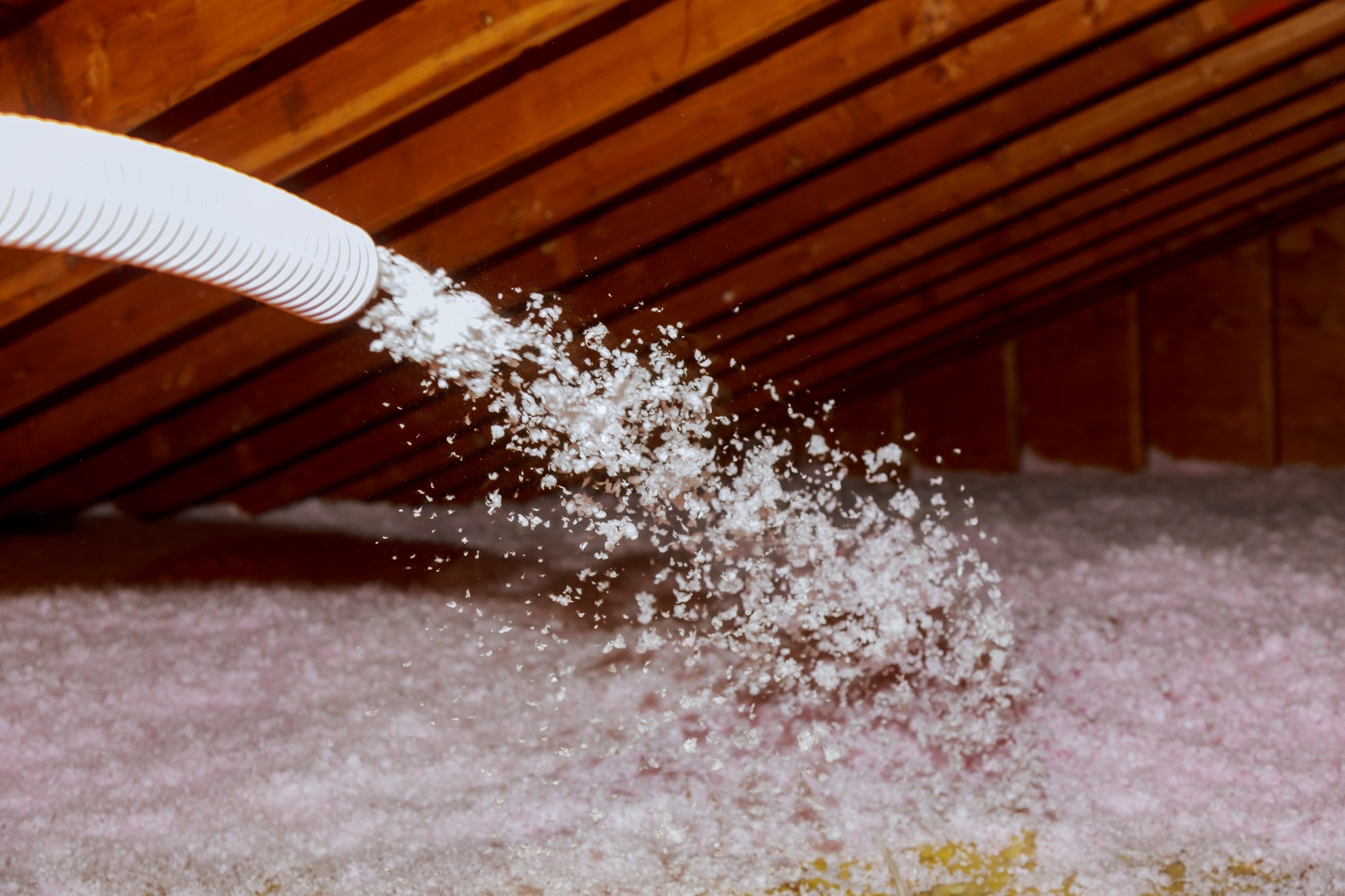 Spraying Blown Fiberglass Insulation for roof technician spraying foam insulation using plural